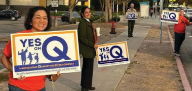 School staff promote Measure Q to parents before school on Oct. 19.